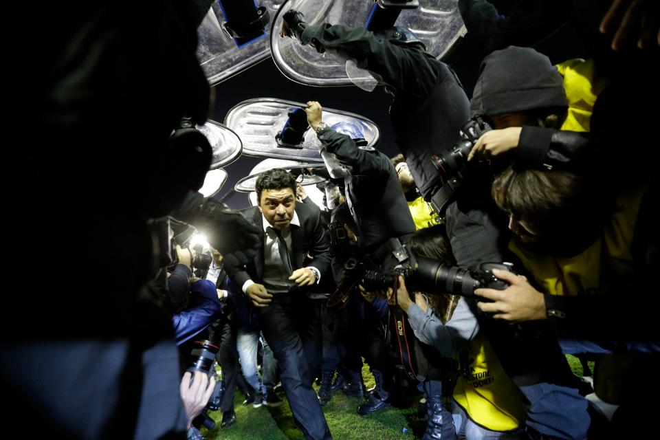  River Plate manager Marcelo Gallardo leaves the pitch under police protection