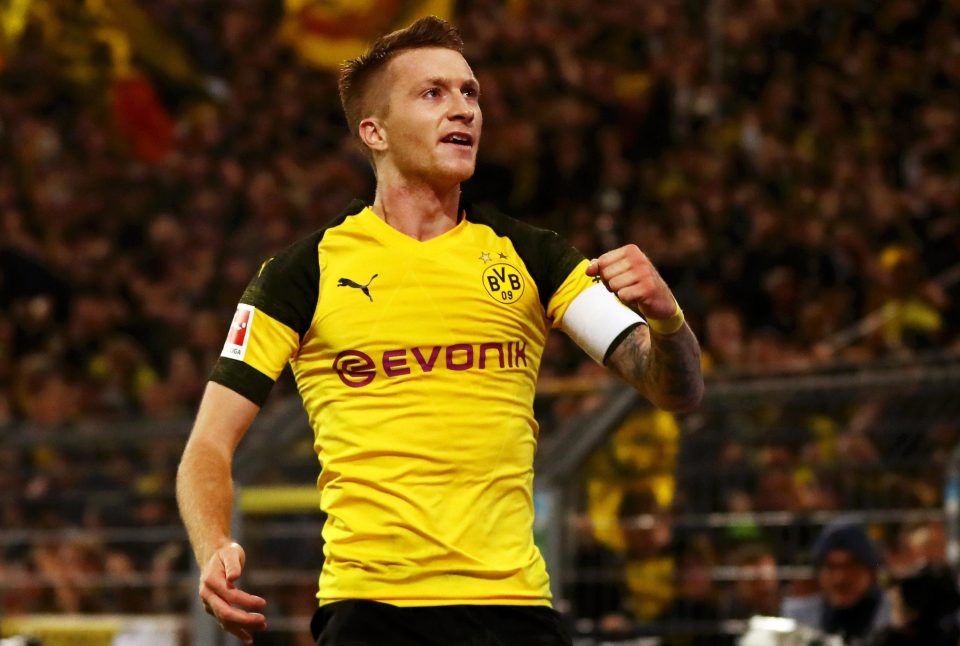  Marco Reus scored twice to keep Dortmund in the game