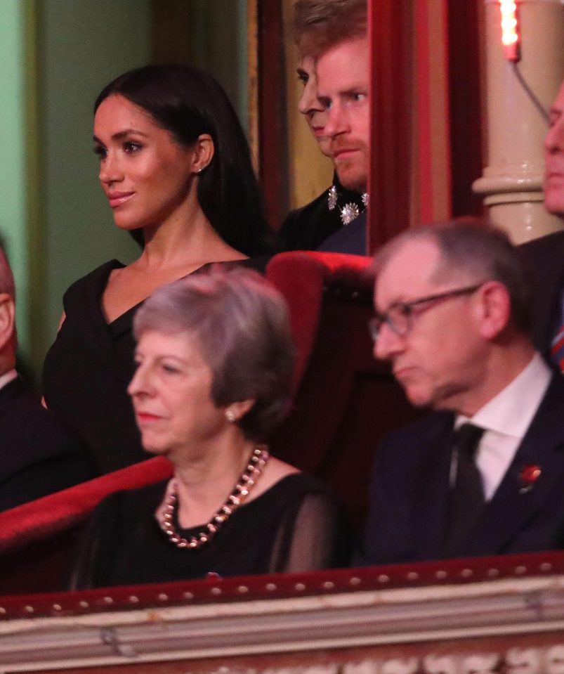  Meghan and Harry watch on behind the PM and her husband Philip