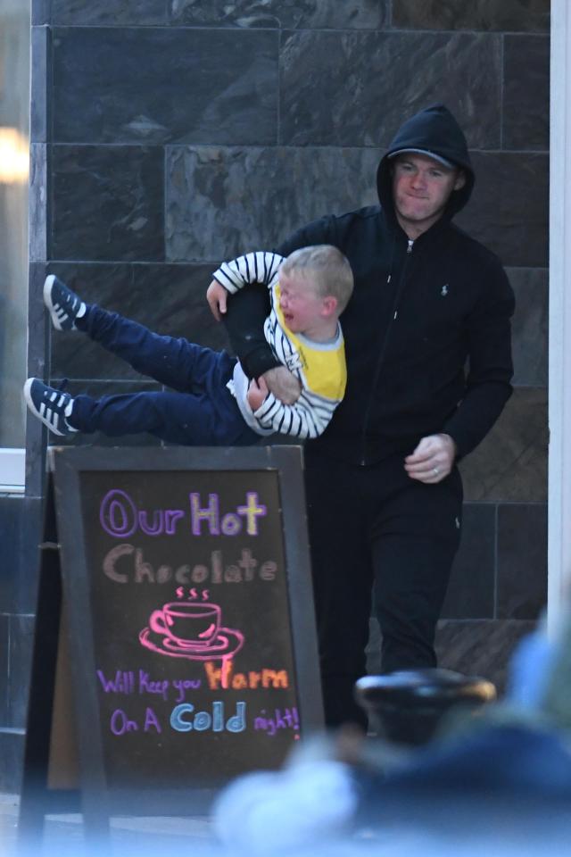  Wayne Rooney dished out some discipline to son Kit, 2, during a family day out