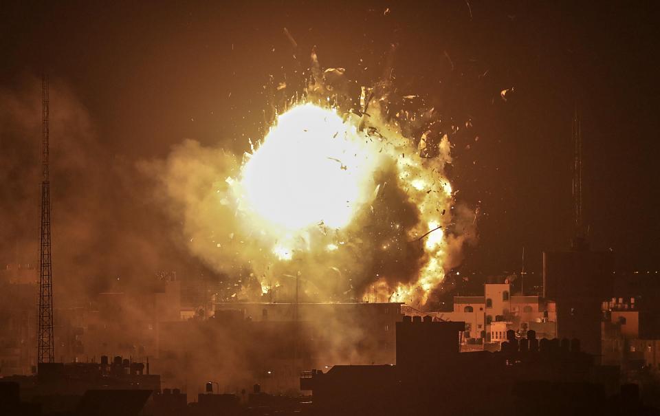  Smoke rises from the building of Al-Aqsa channel belonging to Hamas movement after Israeli air strike in Gaza City