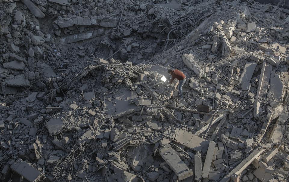  A Palestinian looks at the rubble of a destroyed Hamas site following an Israeli air strike in Gaza City, Gaza Strip