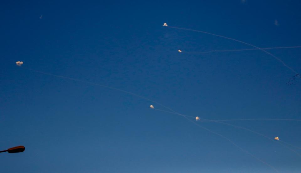  Tails of Iron Dome anti-missile systems as seen over the Israeli kibbutz of Yad Mordechai, near the border with the Gaza Strip, Israel, November 13