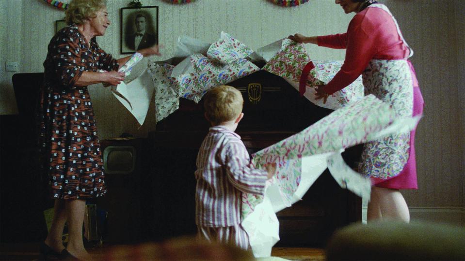  He unwraps a piano given to him by his grandmother