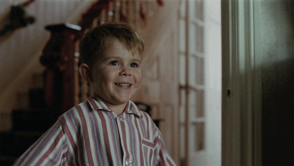  At the end we see a young actor playing Elton John rush down the stairs on Christmas morning