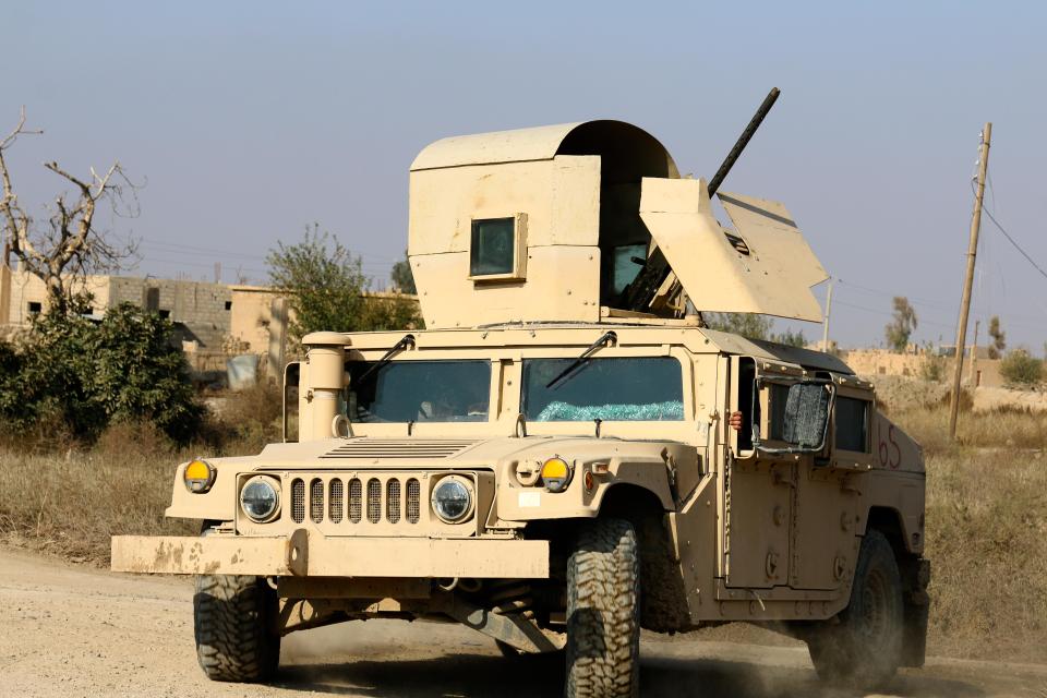  An American armoured vehicle patrols the former war zone