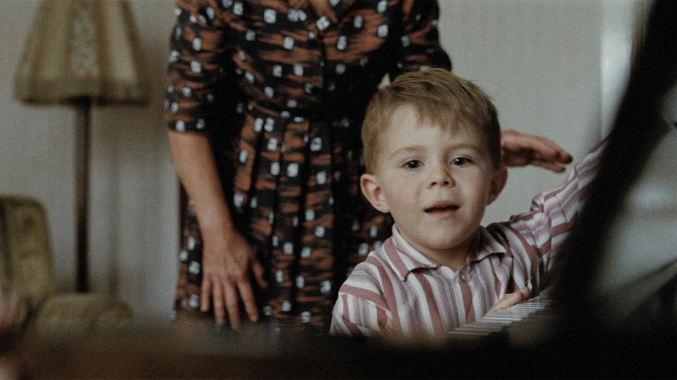 In the advert, an excited Elton John as a small boy opens a piano given to him as a gift