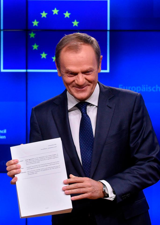  European Council President Donald Tusk shows the draft agreement of the Brexit deal