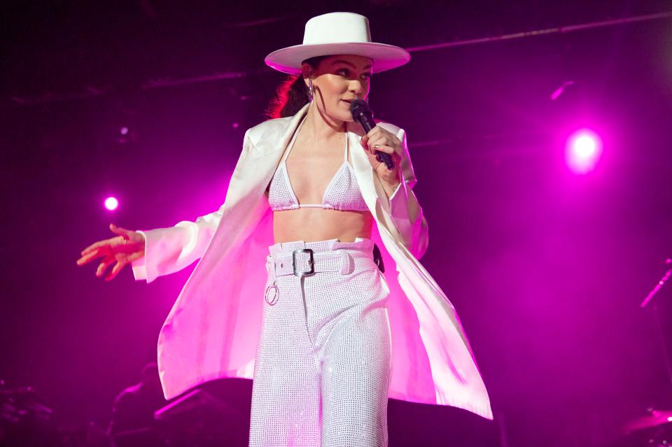  Jessie J dressed in a long coat, high-waisted trousers and a wide-brimmed hat at her Manchester Academy gig on Friday