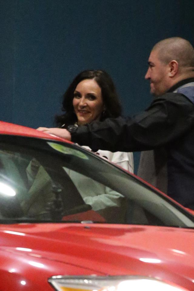  Shirley Ballas was still full of smiles as a security guard helped her into a taxi