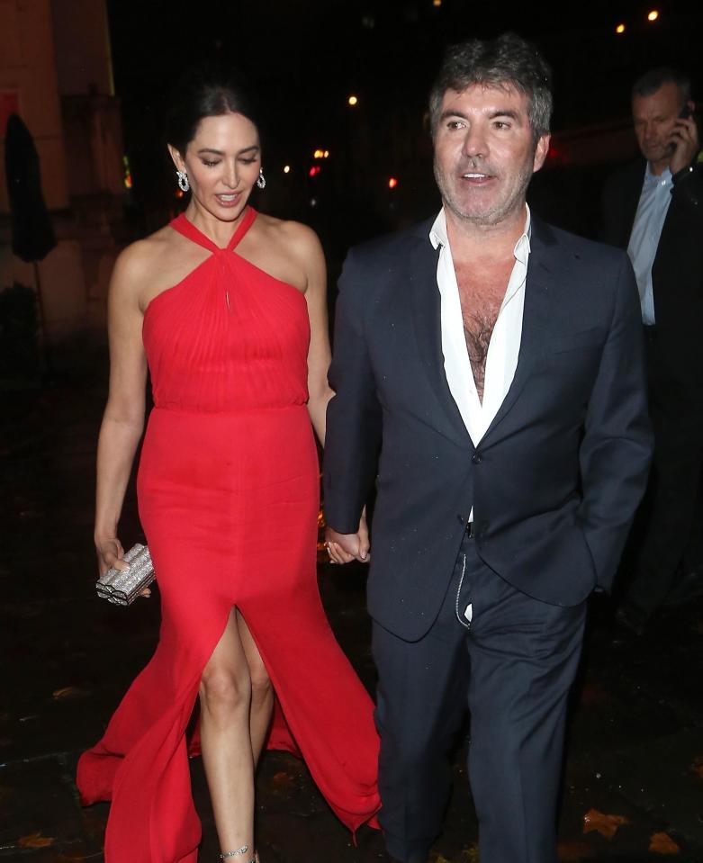  Lauren looked ravishing in a red floor-length dress with slit