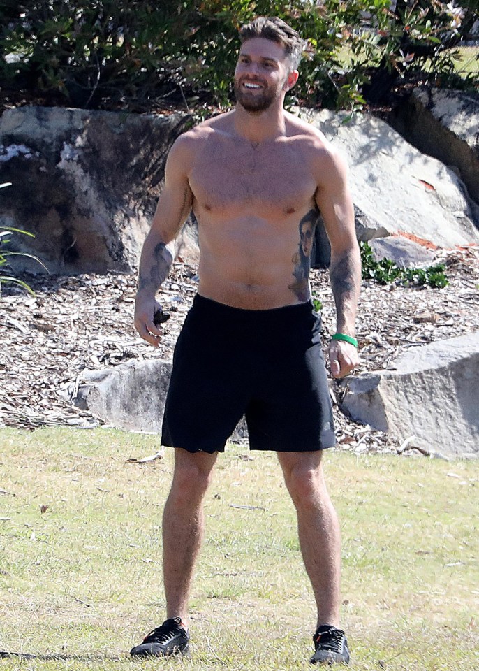 The star, 32, showed off his ripped physique as he played football yesterday