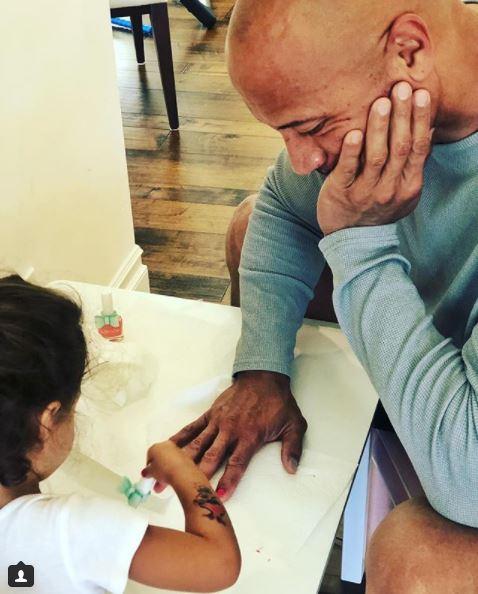  It's not the first time the man mountain has been wrapped around his two-year-old's finger - in September she convinced him to let her paint his nails