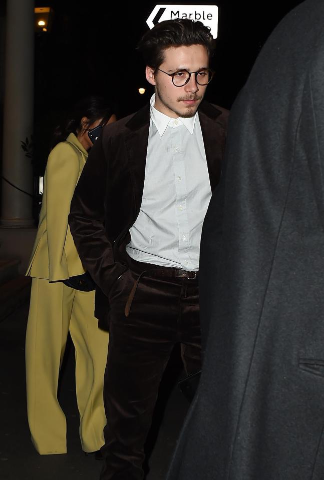  Brooklyn looked stylish in edgy spectacles and a brown velvet suit