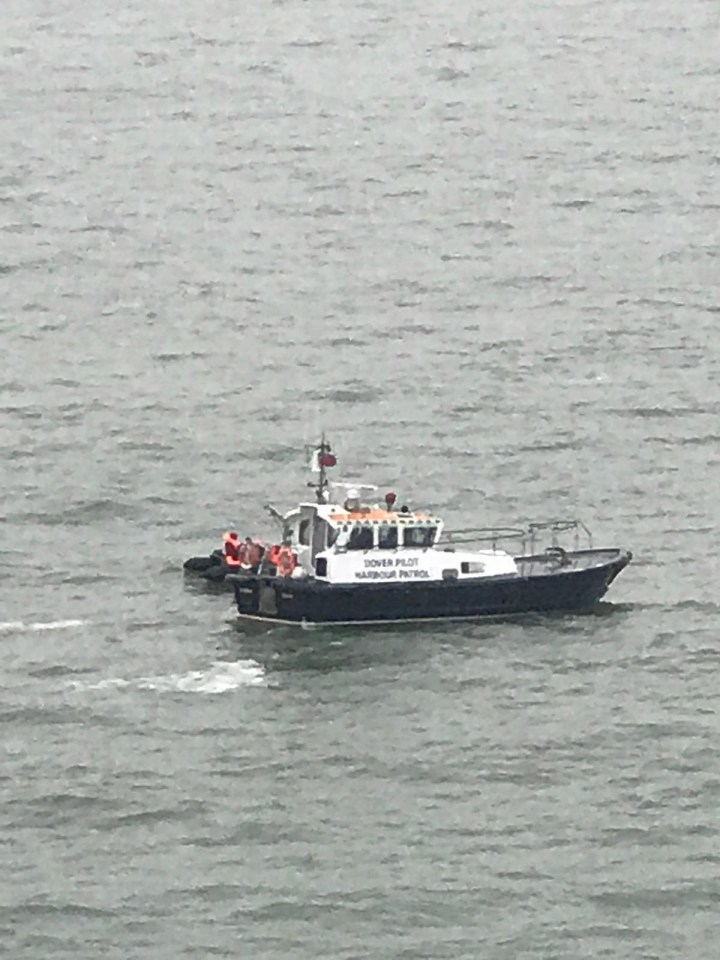 Migrants being rescued off Kent yesterday after trying to cross the Channel in dinghies