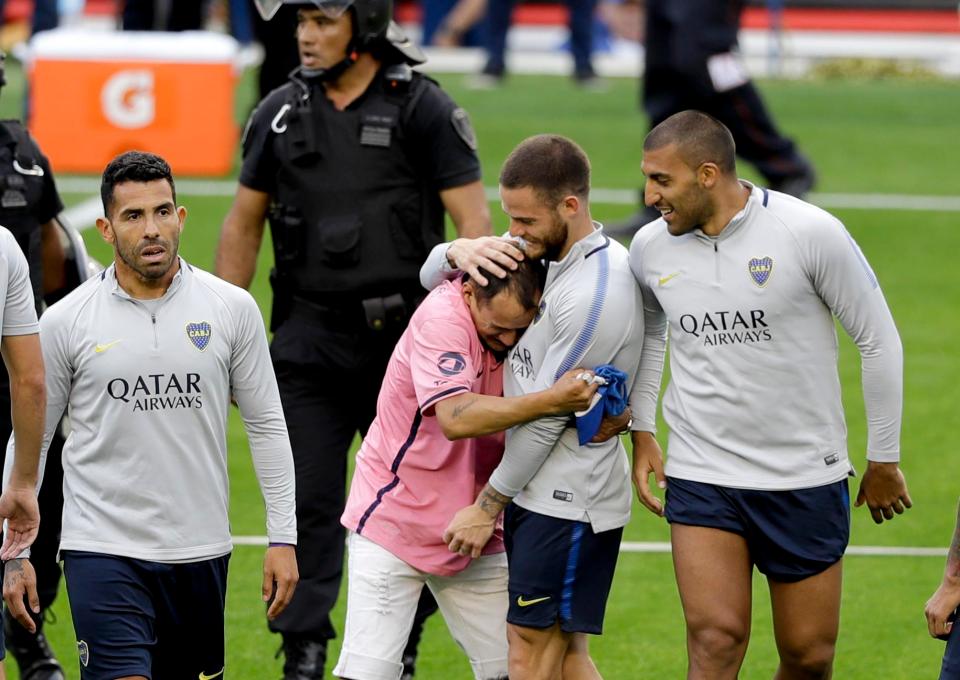 Some fans invaded the pitch to give their idols a hug for good luck