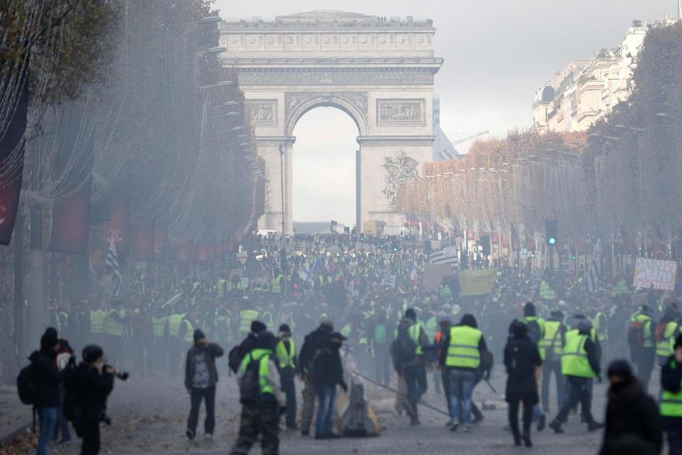  Tear gas shrouded the Arc de Triomphe as battle hit the streets of Paris