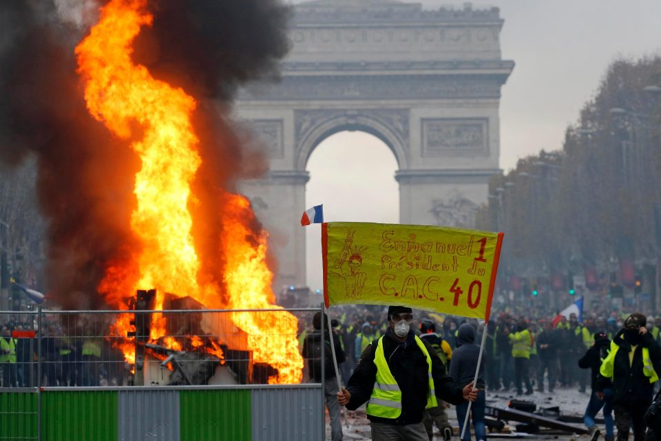  Flames raged by the Arc de Triomphe during the violent clashes