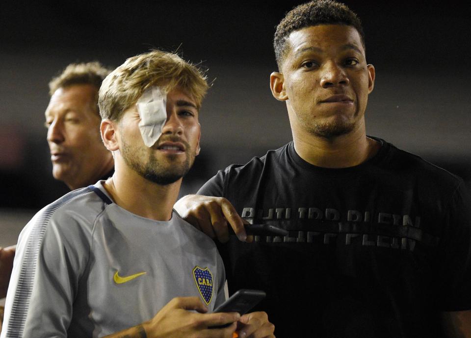 Lamardo and his Boca Juniors team-mate Wilmar Barros look on at the Antonio Vespucio Liberti Stadium