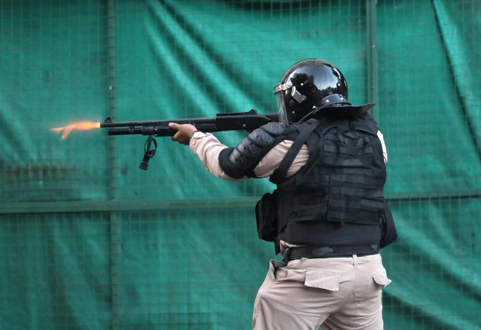 Another police officer shoots with a firearm during the crazy scenes