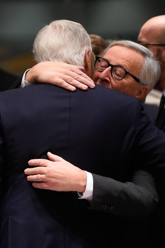  Michel Barnier and Jean Claude Juncker celebrate with a hug at this morning's Brussels gathering