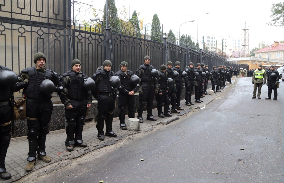 Policemen guard at Russian consulate during a protest action in the Black Sea Ukrainian city of Odessa