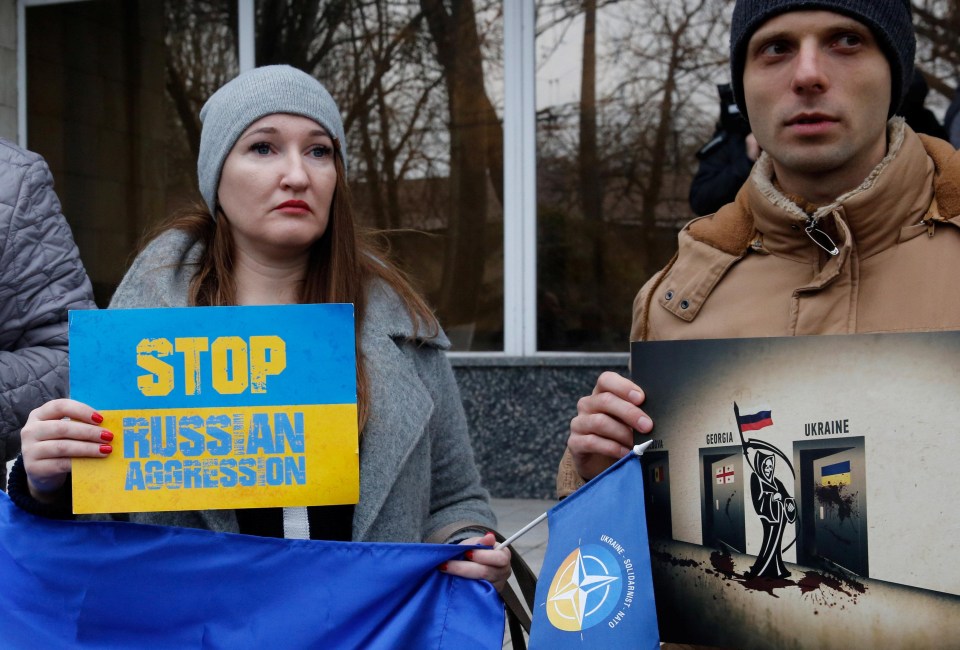 People attend a rally to support the Ukrainian navy in the Black Sea port of Odessa