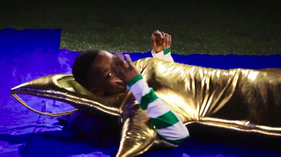  The 15-year-old prodigy wore a star costume in a video released by the club