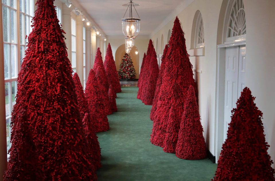  A hall in the White House was decked with 18-foot blood-red Christmas trees