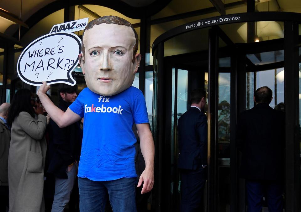  Campaigner wears oversized mask of Mark Zuckerberg after he failed to attend a meeting on fake news held by Parliament's Digital, Culture and Sport committee