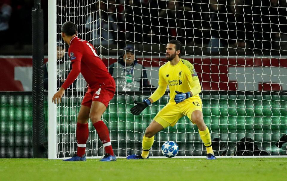  Alisson watches Juan Bernat's deflected effort beat him for PSG's first goal