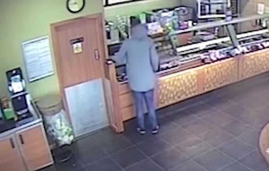  The thief tried to keep cool before he snatched the charity box