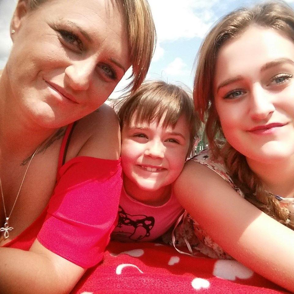 Debbie (here with daughters Mollie, 9, and Kayleigh,21) has been helped out by the DWP to get a better debt repayment scheme – after being contacted by The Sun