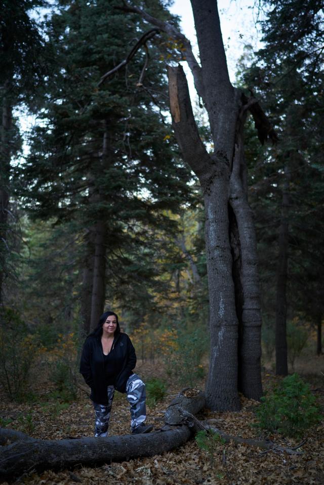  Claudia next to the tree where she saw the creature perched about 30 feet up