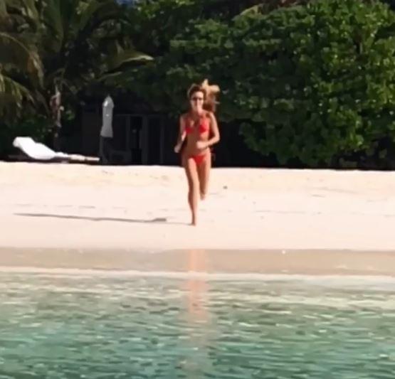  Amanda is currently on holiday - but has found time to pretend she's Pamela Anderson in Baywatch