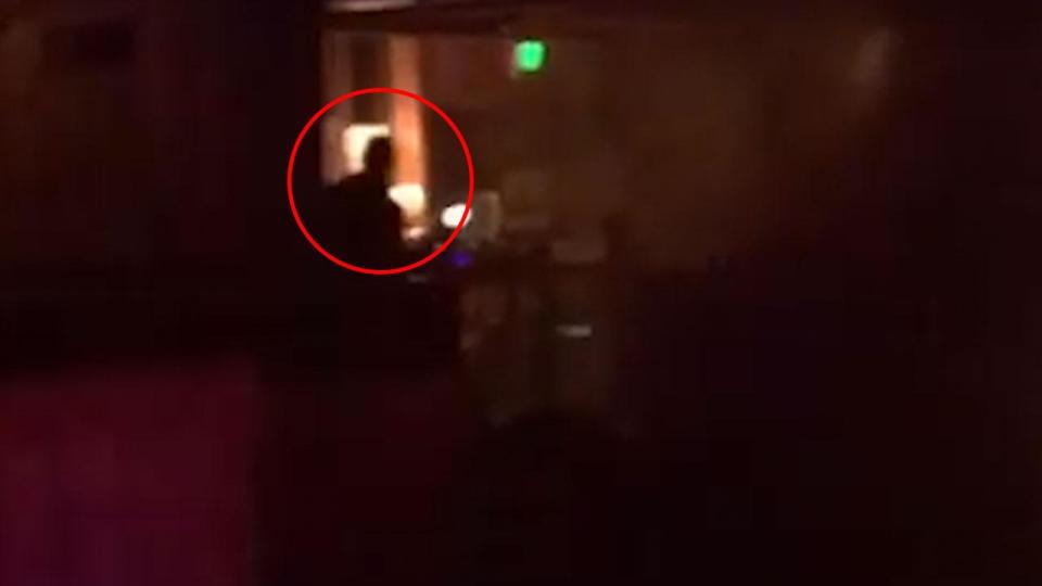  The suspected gunman is caught on camera for just a fraction of a second