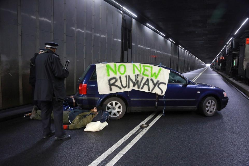  Environmental activists, such as this one at Heathrow Airport, could be to blame