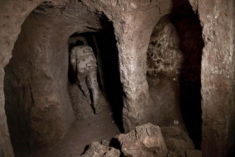  An Iraqi soldier in a tunnel in Mosul, used as a training centre by jihadists