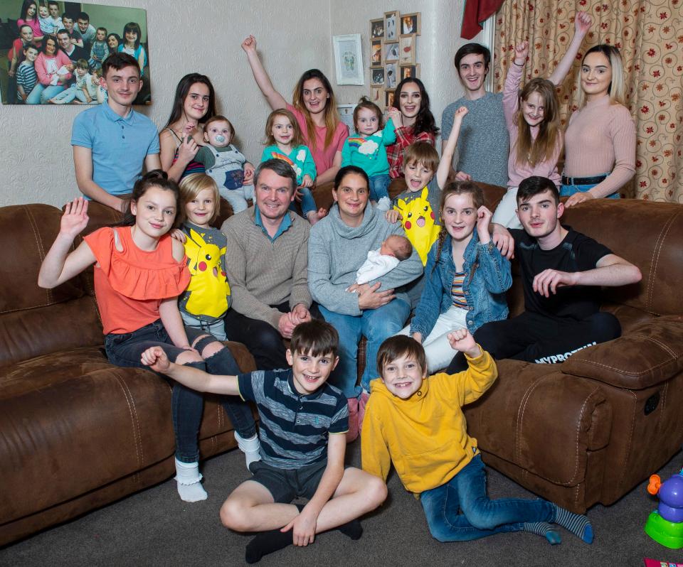  Sue and Noel Radford with 19 of their children at their converted care home