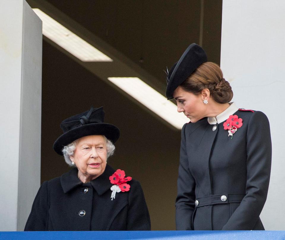  The Duchess of Cambridge talks to the Queen ahead of a moment's silence on Armistice Day in November 2018