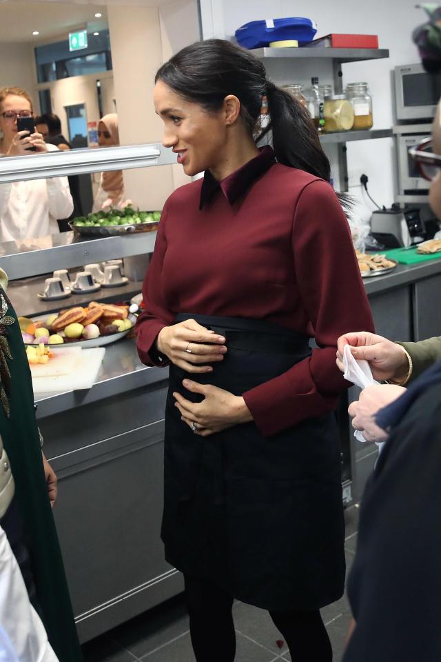  Meghan has been spotted cradling her bump a number of times - and experts say it is healthy for her and baby