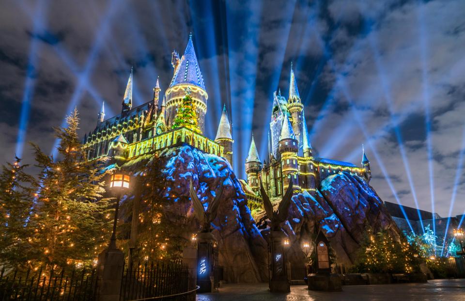  The Hogwarts Castle lights up while the choir is belting out Harry Potter tunes