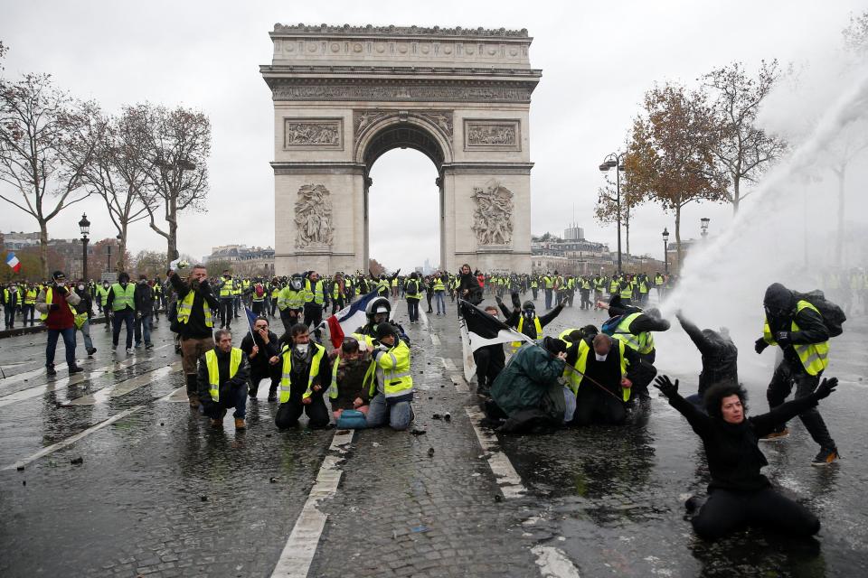  Yellow vest protesters in France face-off with riot police against proposed fuel tax hikes