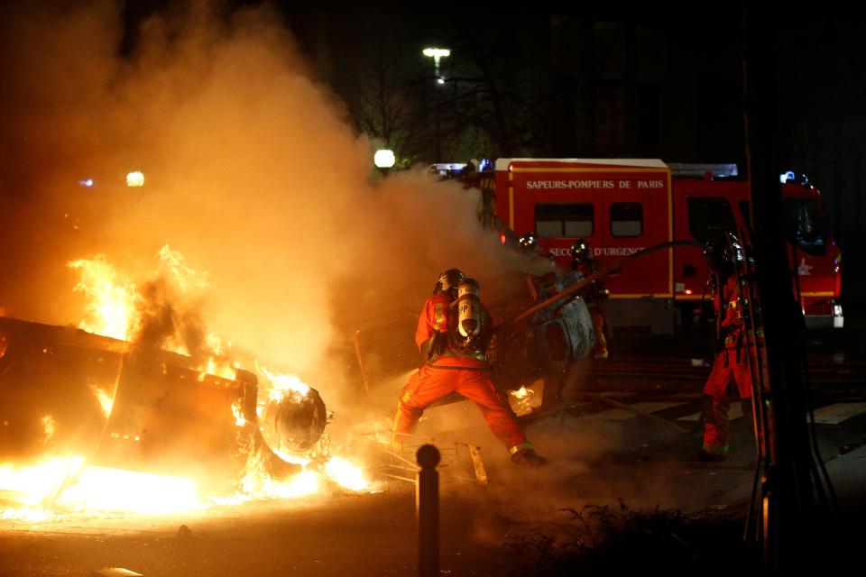  Firefighters tackle a blazing car last night