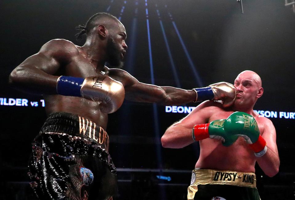 Deontay Wilder catches Tyson Fury with a left hand