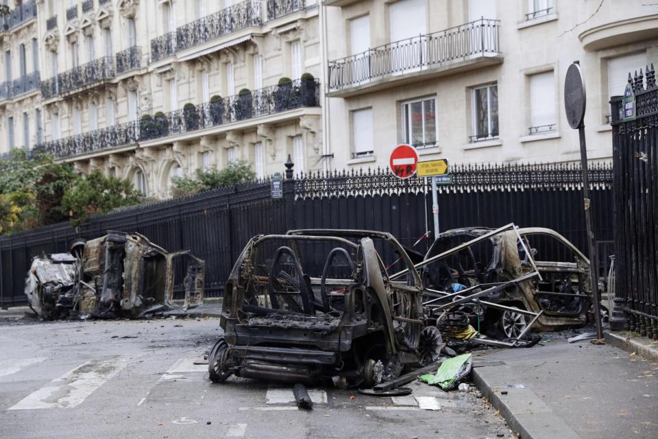  Burnt out cars line the streets of Paris in the aftermath of yesterday's violence