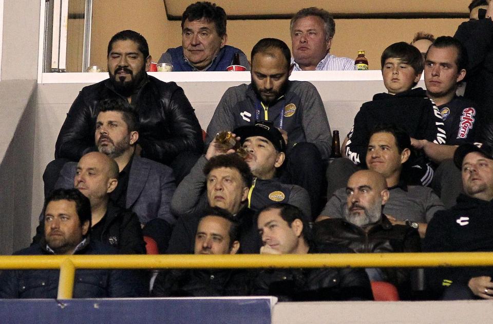 Maradona was even spotted drinking a bottle of beer during the game