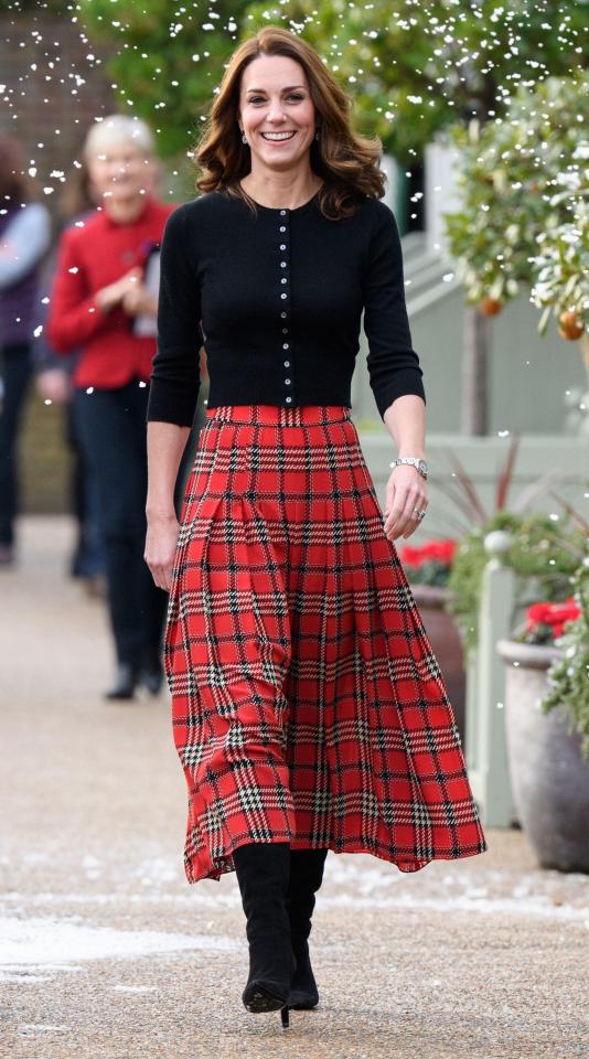  The Duchess of Cambridge looked suitably festive as she welcomed RAF families into her Kensington Palace home