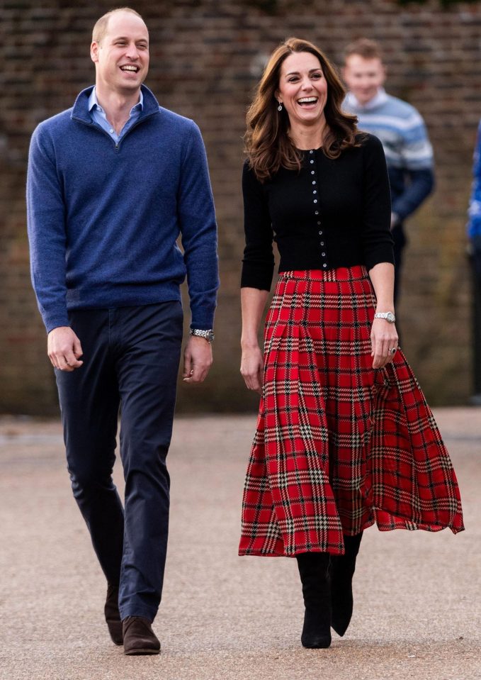  Kate gave this classic outfit a modern update with a button-up cardigan and longer skirt