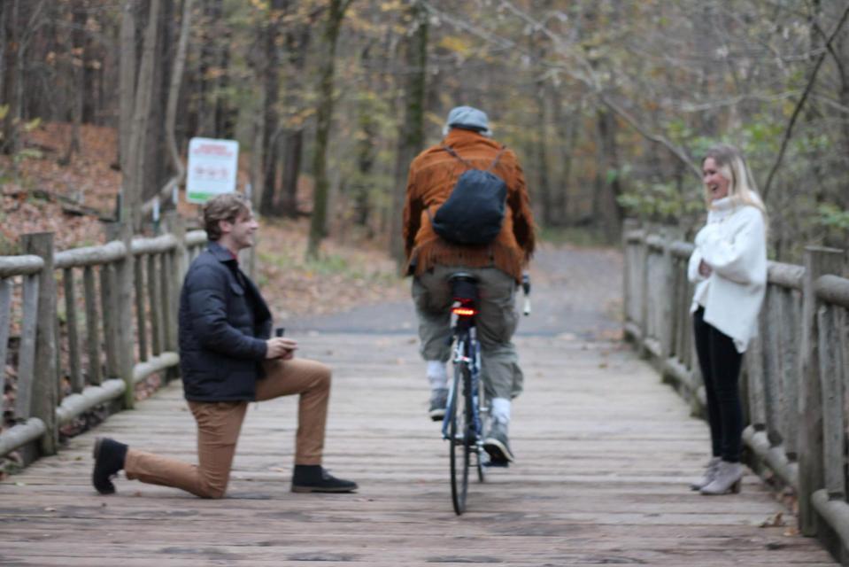  The moment a cyclist ruins a romantic marriage proposal on a wooden bridge in Cherokee Park in Louisville